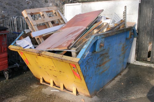 Team sorting items for house clearance